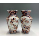 A pair of Japanese Imari dragon moulded vases, early 20th century, height 29.5cm, width 17cm.