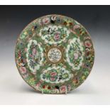 A Chinese Canton porcelain plate, 19th century, for the Islamic market, the central medallion filled