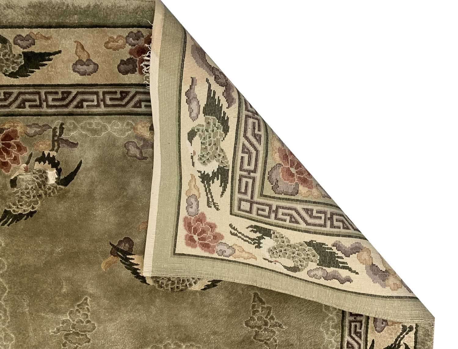 A Chinese 'art silk' rug, the green field with flowers and birds, within an ivory similar border, - Image 2 of 3