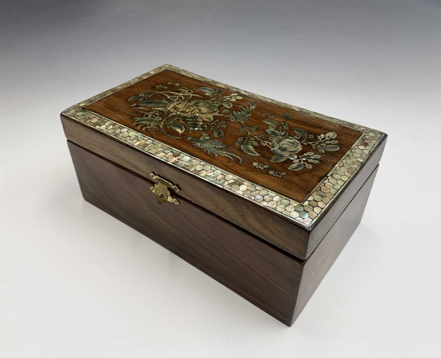 A Chinese hardwood and mother of pearl work box, the top inlaid with foliage, butterflies and a