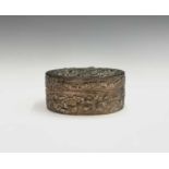 A Chinese silver oval box, with foliate decoration and character mark to base, height 3cm, width