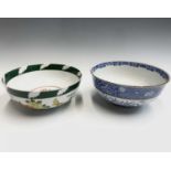 A Chinese blue and white bowl, circa 1900, decorated with a figure and a deer in a garden, with four