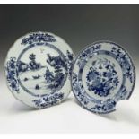 A Chinese blue and white porcelain plate, 18th century, depicting a river scene, diameter 35.5cm and