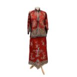 A Chinese silk embroidered summer jacket and skirt, circa 1920, with floral sprays and gold metal