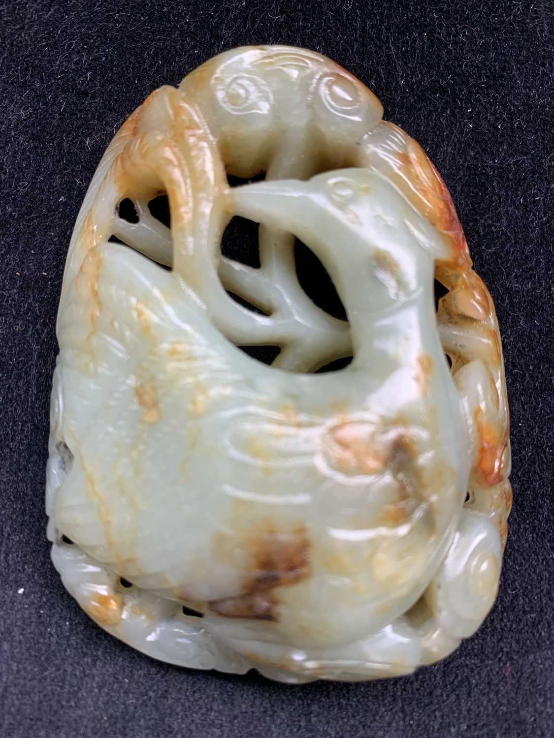 A Chinese carved & reticulated celadon jade ornament, depicting a bird & lingzhi, with russet - Image 9 of 14