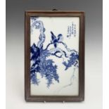 A Chinese blue and white porcelain panel, 20th century, with birds perched on a branch, script and