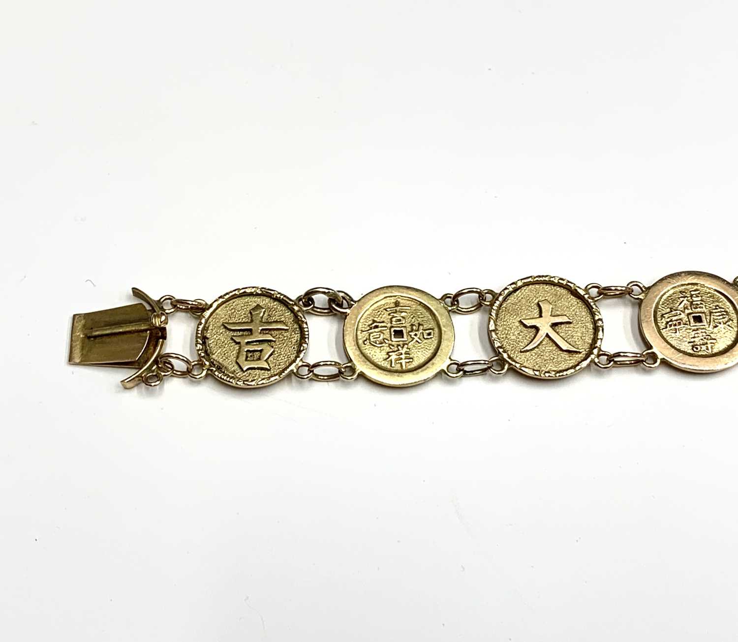 A Chinese gold bracelet with twelve 'cash' links, length 19.5cm, weight 12.5 grams.Condition report: - Image 4 of 7