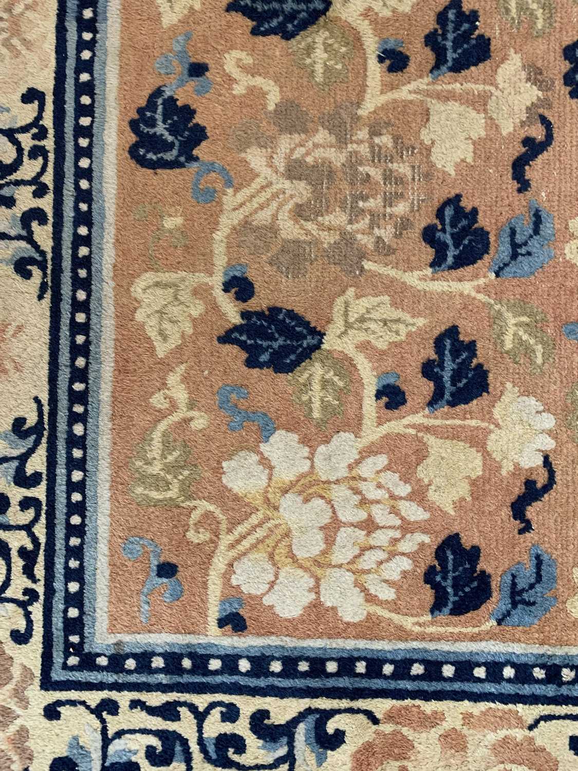A Chinese carpet, 19th century, the camel field with rows floral sprays, within a saffron - Image 4 of 22