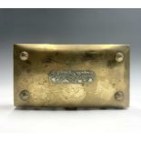 A Chinese brass rectangular box, early 20th century, the hinged cover with a silver foliate