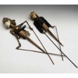 Two Java painted wood puppets, length 71cm.