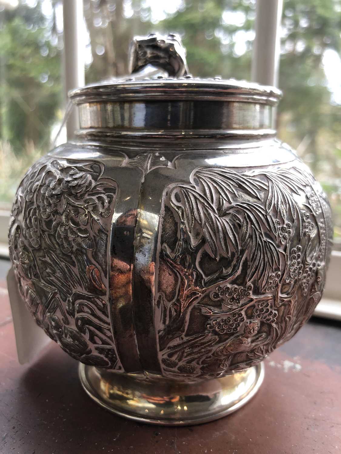 A Chinese silver globular tea caddy, the body with four shaped panels enclosing garden scenes - Image 10 of 12