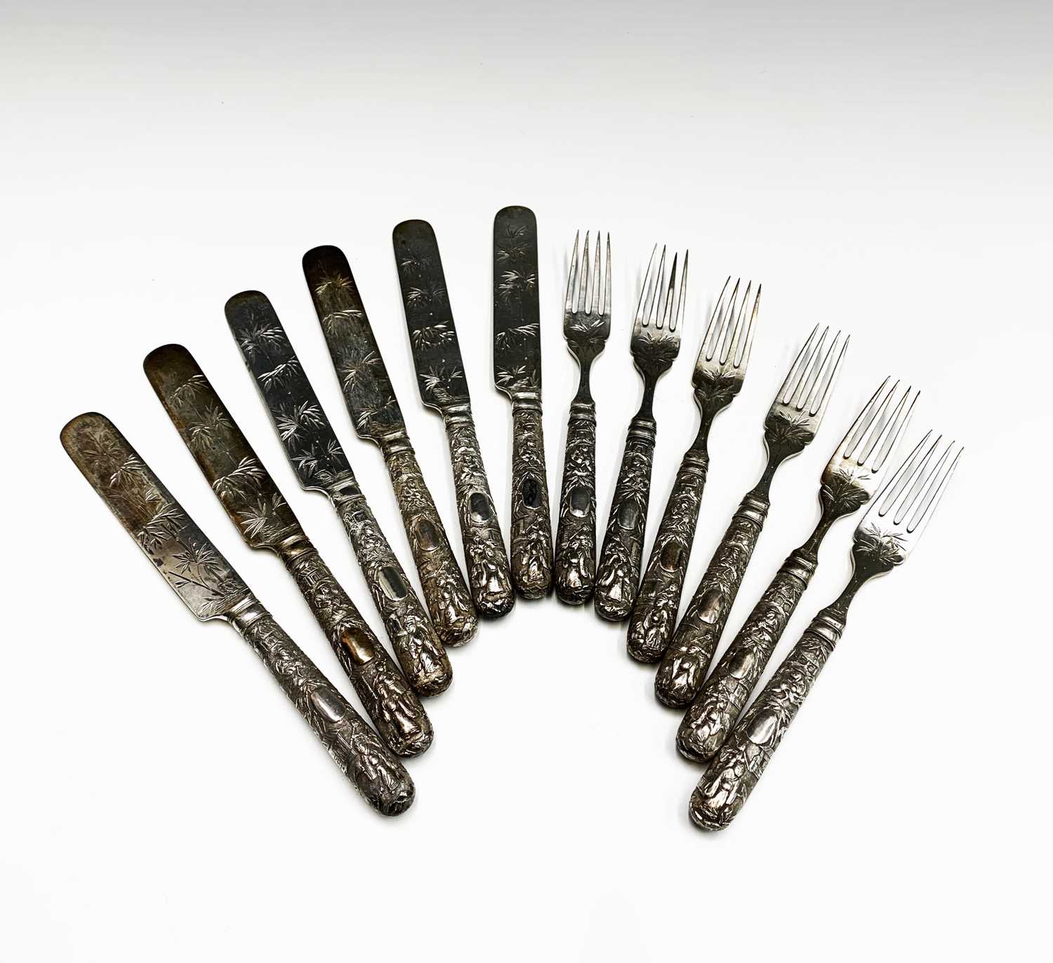 A set of six Chinese silver dessert knives and forks, the prongs with impressed character mark and
