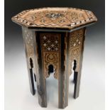 A Damascus marquetry occasional table, Syria, circa 1880, the octagonal inlaid top with