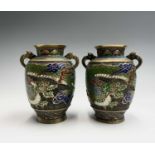 A pair of Japanese champleve twin handled brass vases, early-mid 20th century, decorated with