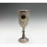 An Indian silver goblet, 19th century, with a plain shield and chased with foliate scroll