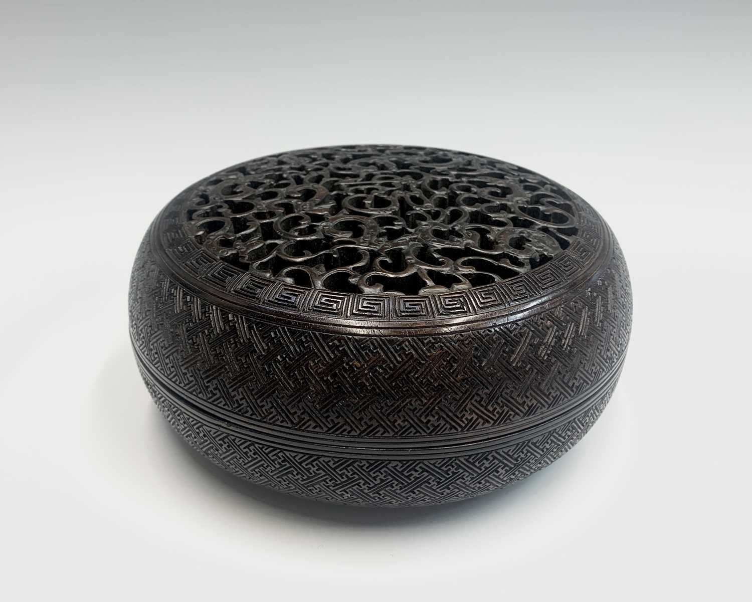 A Chinese Zitan wood circular box and cover, 18th century, the pierced cover carved with nine - Image 6 of 25