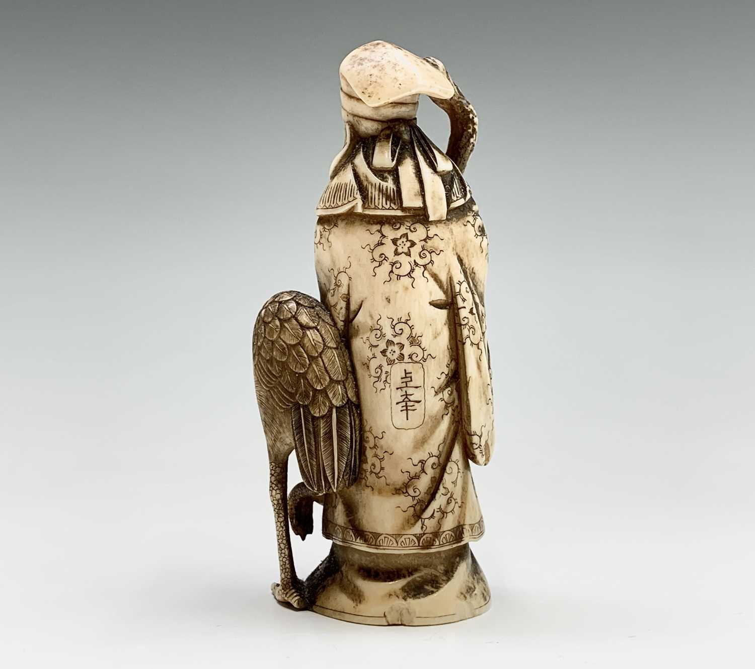 A Chinese carved ivory figure of Shouxing, 19th century, character marks, with staff in hand - Image 2 of 7