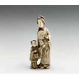 A Chinese carved ivory group of a mother and child, 19th century, character marks on rear, height