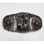 A Burmese silver buckle, with figures flanked by peacocks, 7.5 x 13.5cm, weight 92.6cm.