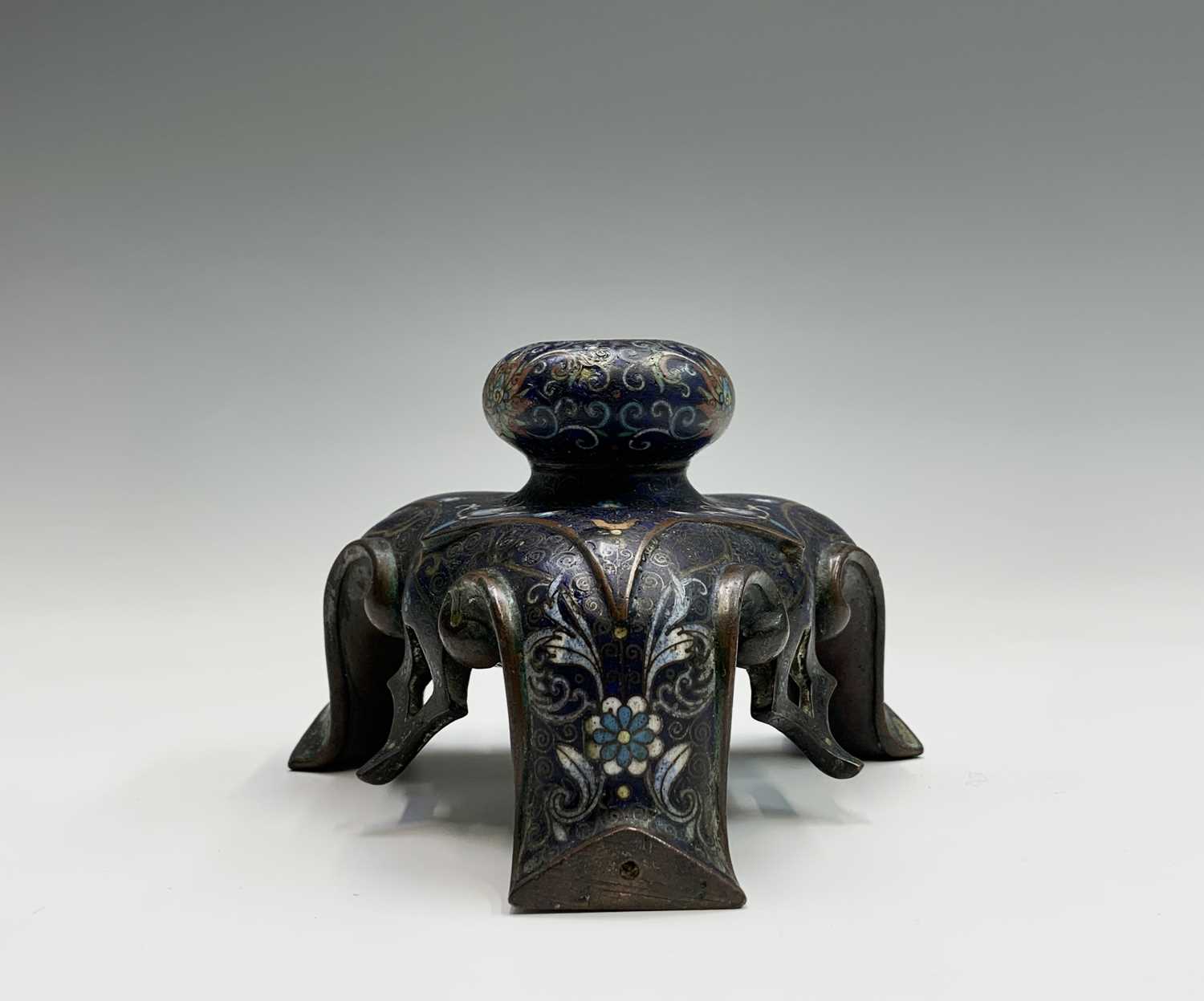 An unusual Chinese bronze and cloisonne stand, possibly 18th century, height 8.5cm, width 13cm.