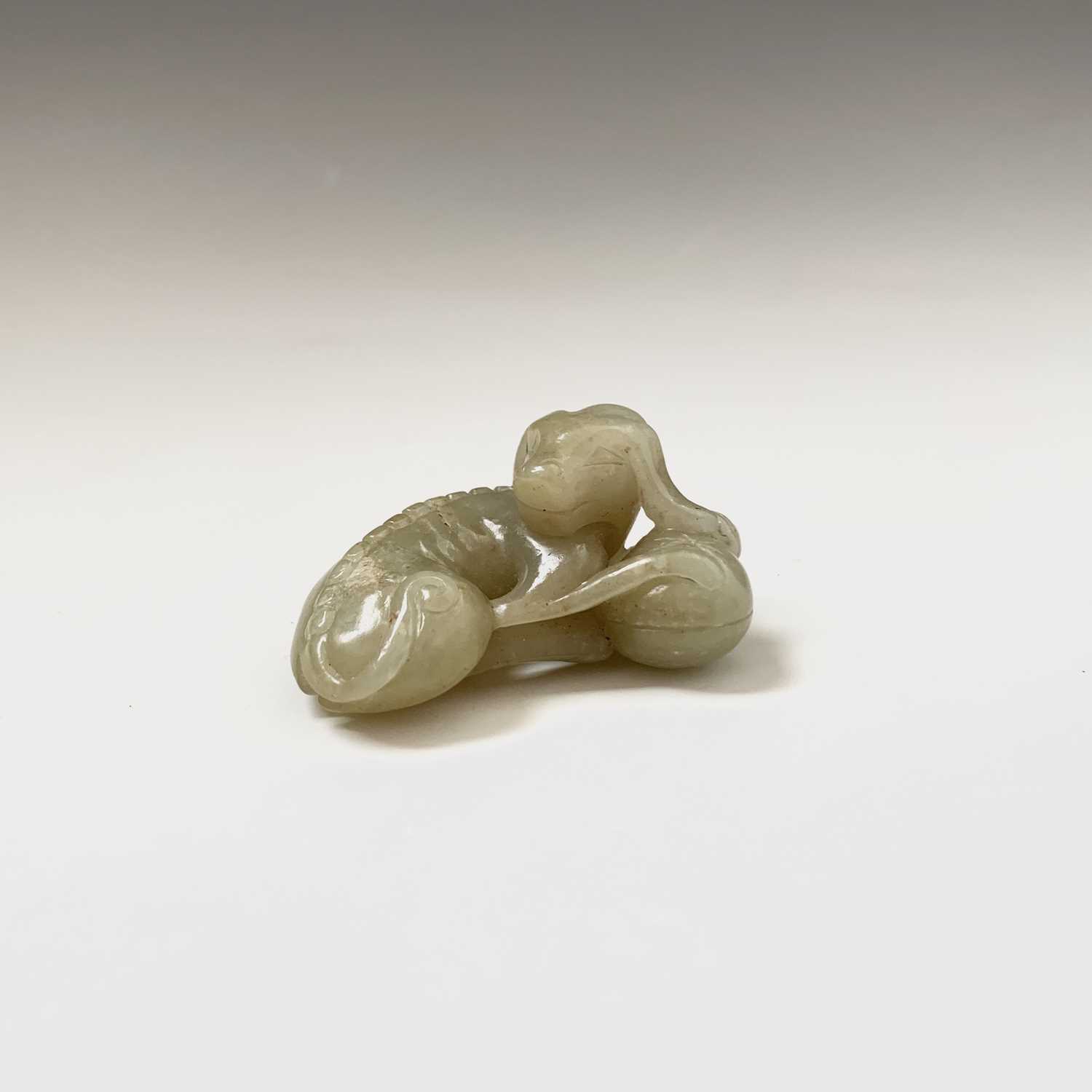 A Chinese jade carving of a recumbent hound, Qing dynasty, height 2.5cm, width 5cm, depth 3.5cm - Image 9 of 9