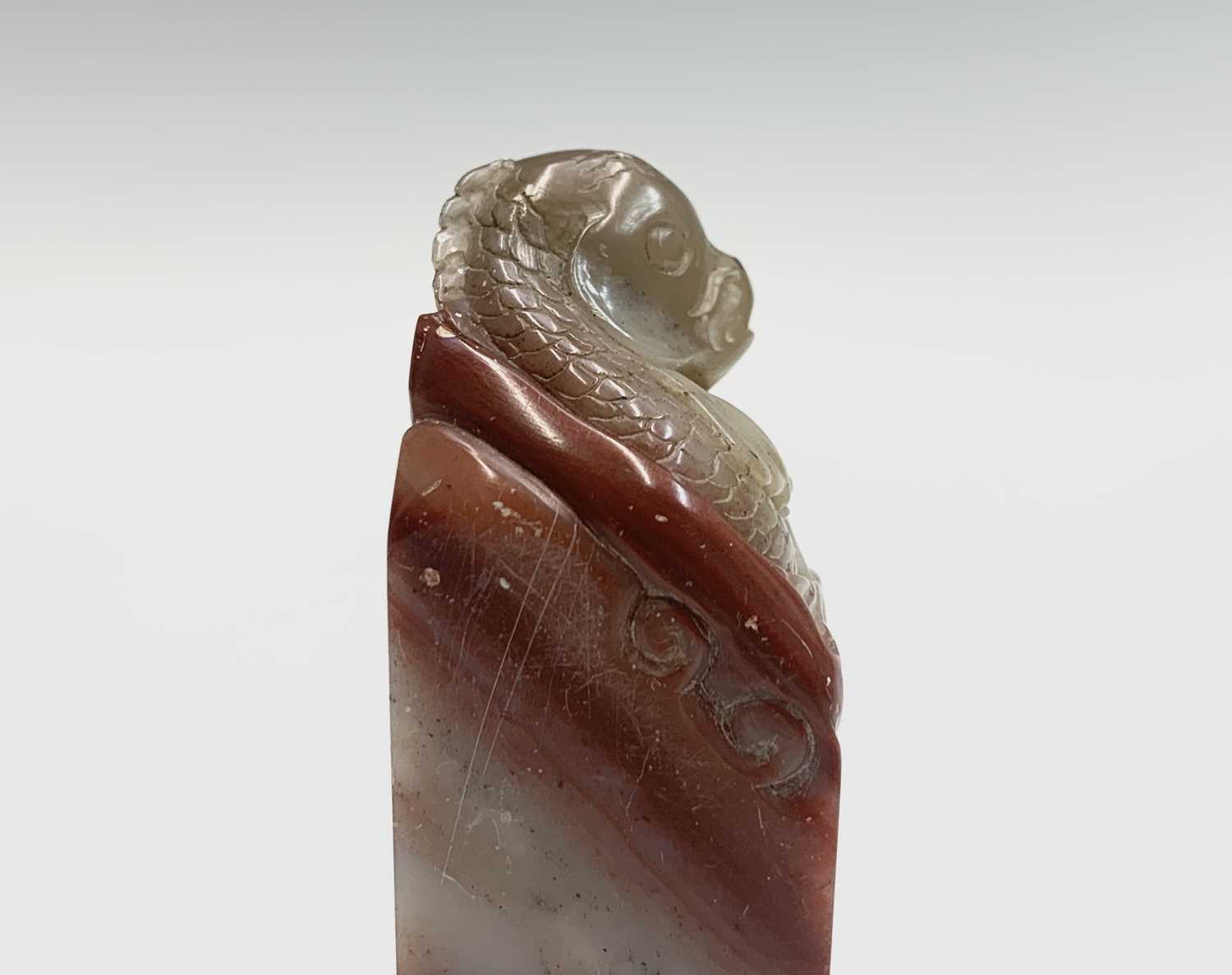 A Chinese hardstone seal, 19th century, surmounted by a carved carp, height 7.5cm. - Image 4 of 7