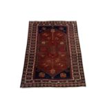 A North West Persian rug, the field with a large central polychrome medallion, indigo spandrels,