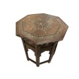 An Hoshiarpur folding octagonal occasional table, Northern India, 19th century, with inlaid ebony