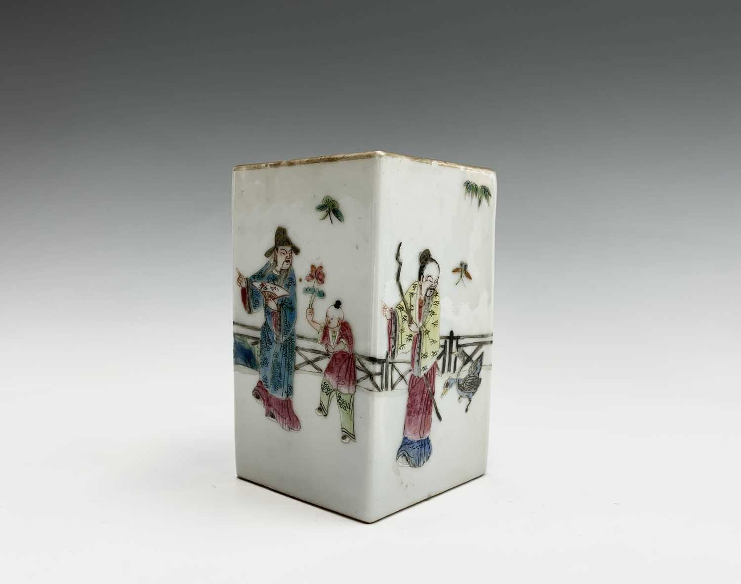 A Chinese famille rose porcelain square brush pot, 19th century, the garden scene with figures,