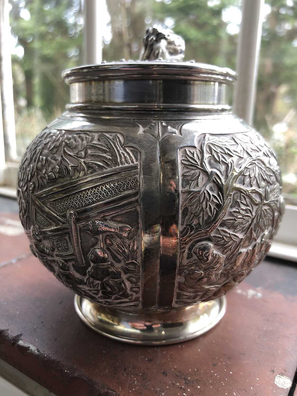 A Chinese silver globular tea caddy, the body with four shaped panels enclosing garden scenes - Image 7 of 12