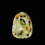 A Chinese carved & reticulated celadon jade ornament, depicting a bird & lingzhi, with russet