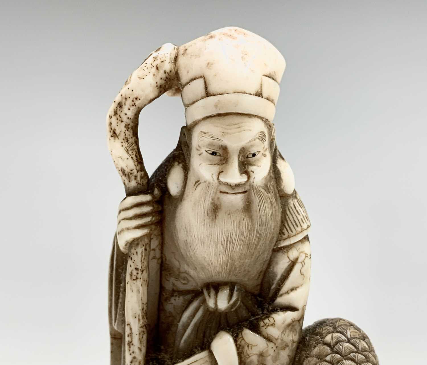 A Chinese carved ivory figure of Shouxing, 19th century, character marks, with staff in hand - Image 7 of 7