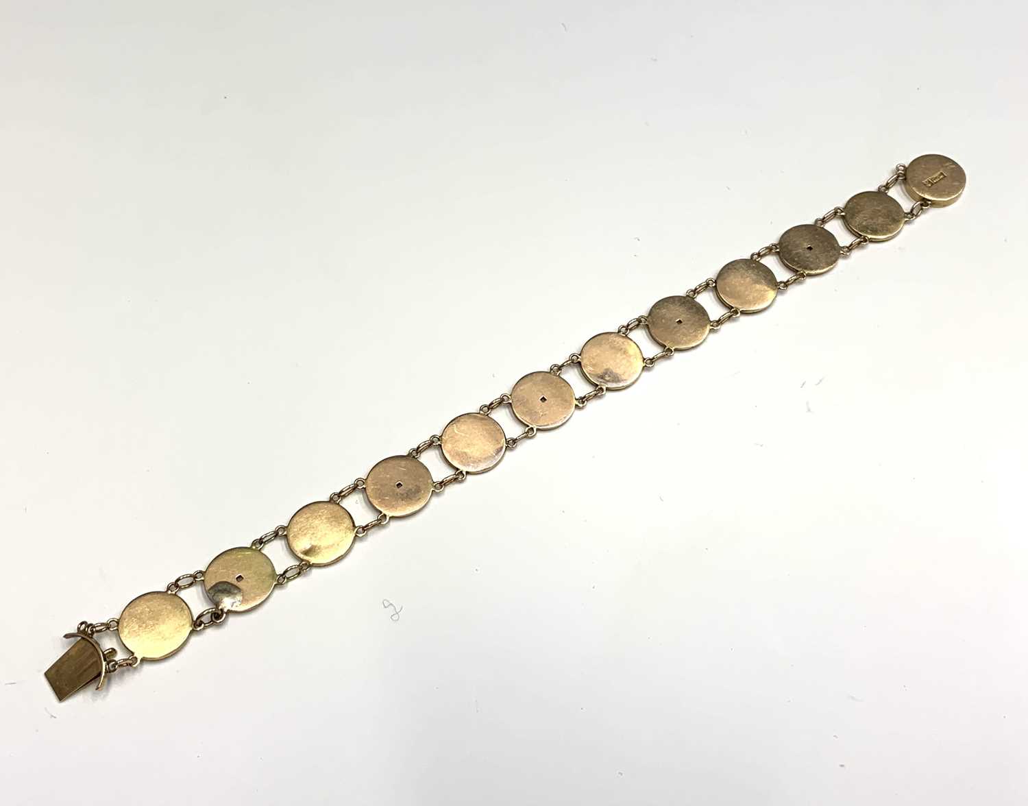 A Chinese gold bracelet with twelve 'cash' links, length 19.5cm, weight 12.5 grams.Condition report: - Image 2 of 7