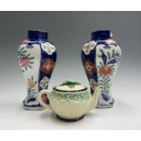 A pair of Japanese Imari octagonal vases, height 29cm and a Japanese Maruhon Ware pottery teapot,