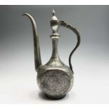 A Persian tinned copper ewer, 18th/19th century, with scrolling floral decoration to front and rear,