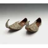 A pair of Turkish leather and silver metal thread shoes, length 24cm, width 8cm.Condition report: