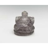 An Indian rock crystal amulet of Ganesh, height 4cm, together with a 19th century ivory model of a