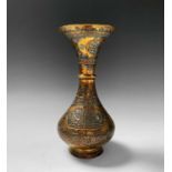 A Cairoware brass vase, Egypt, 19th century, decorated in silver and copper inscription filled