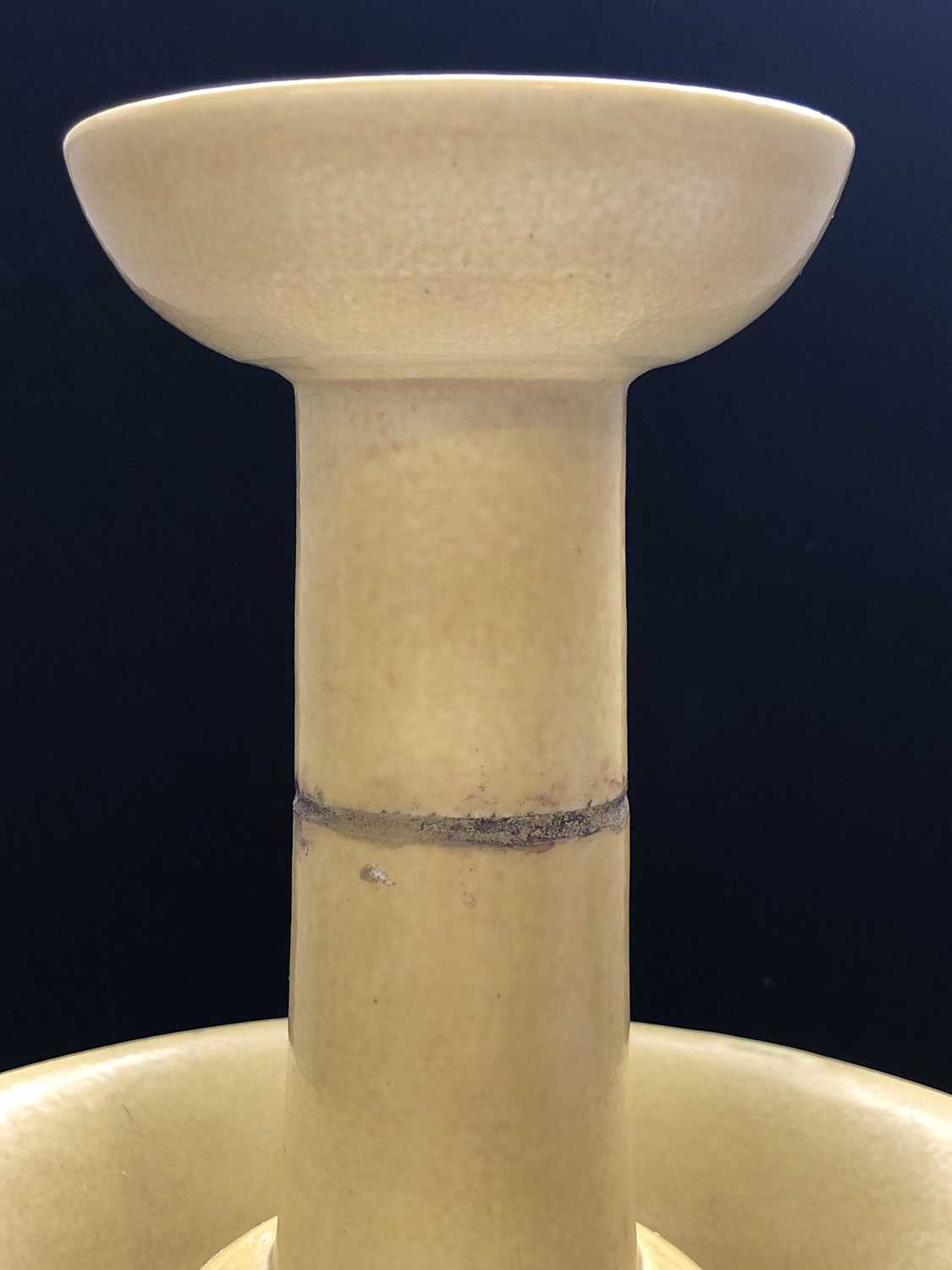 A Chinese yellow glazed porcelain candlestick holder, 18th/19th century, with a four-character - Image 9 of 28