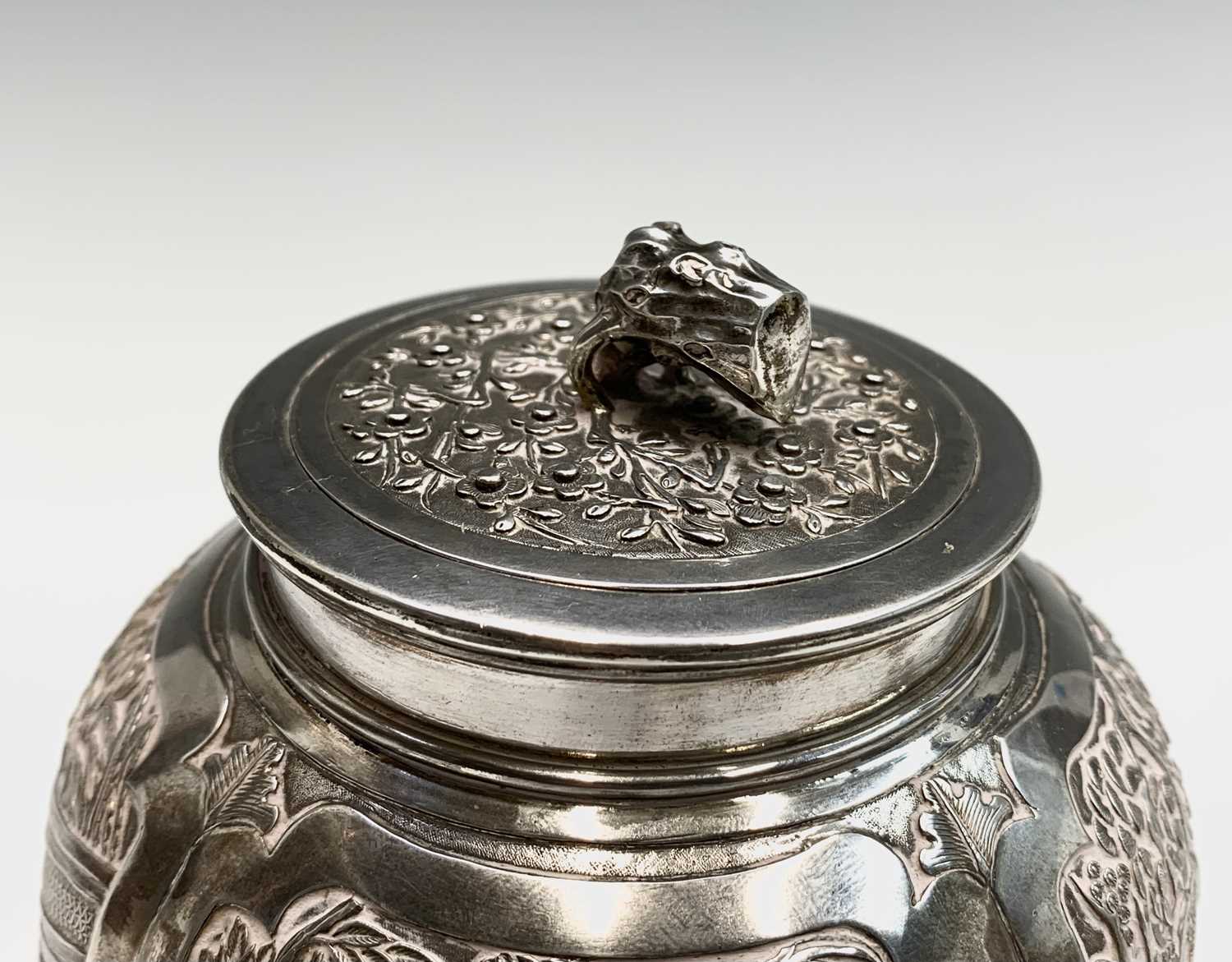 A Chinese silver globular tea caddy, the body with four shaped panels enclosing garden scenes - Image 2 of 12