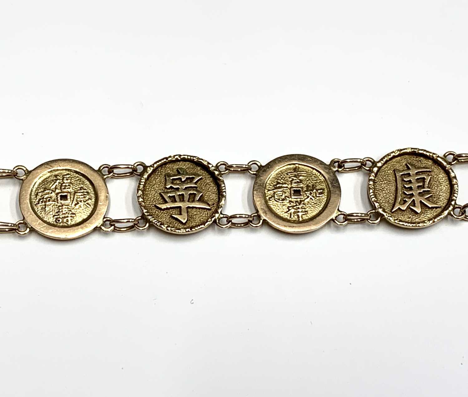 A Chinese gold bracelet with twelve 'cash' links, length 19.5cm, weight 12.5 grams.Condition report: - Image 6 of 7