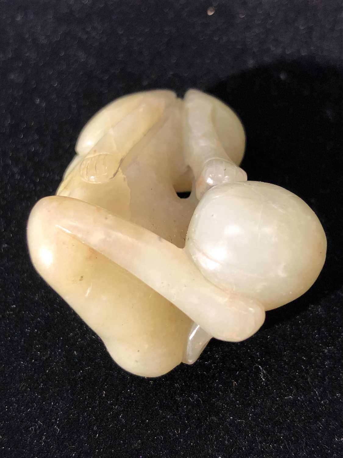 A Chinese jade carving of a recumbent hound, Qing dynasty, height 2.5cm, width 5cm, depth 3.5cm - Image 8 of 9