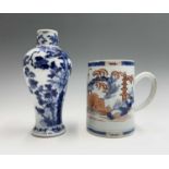 A Chinese export porcelain mug, 18th century, height 15.5cm, diameter 10.5cm and a Chinese blue
