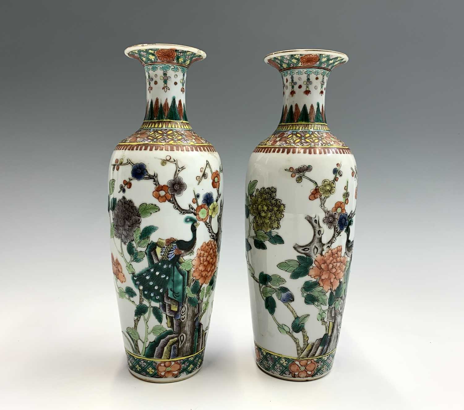 A pair of Chinese famille verte porcelain vases, Qianlong four character mark, with an exotic bird