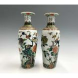 A pair of Chinese famille verte porcelain vases, Qianlong four character mark, with an exotic bird
