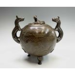 A Chinese bronze censer and cover, 20th century, of globular form, with applied dragon handles and