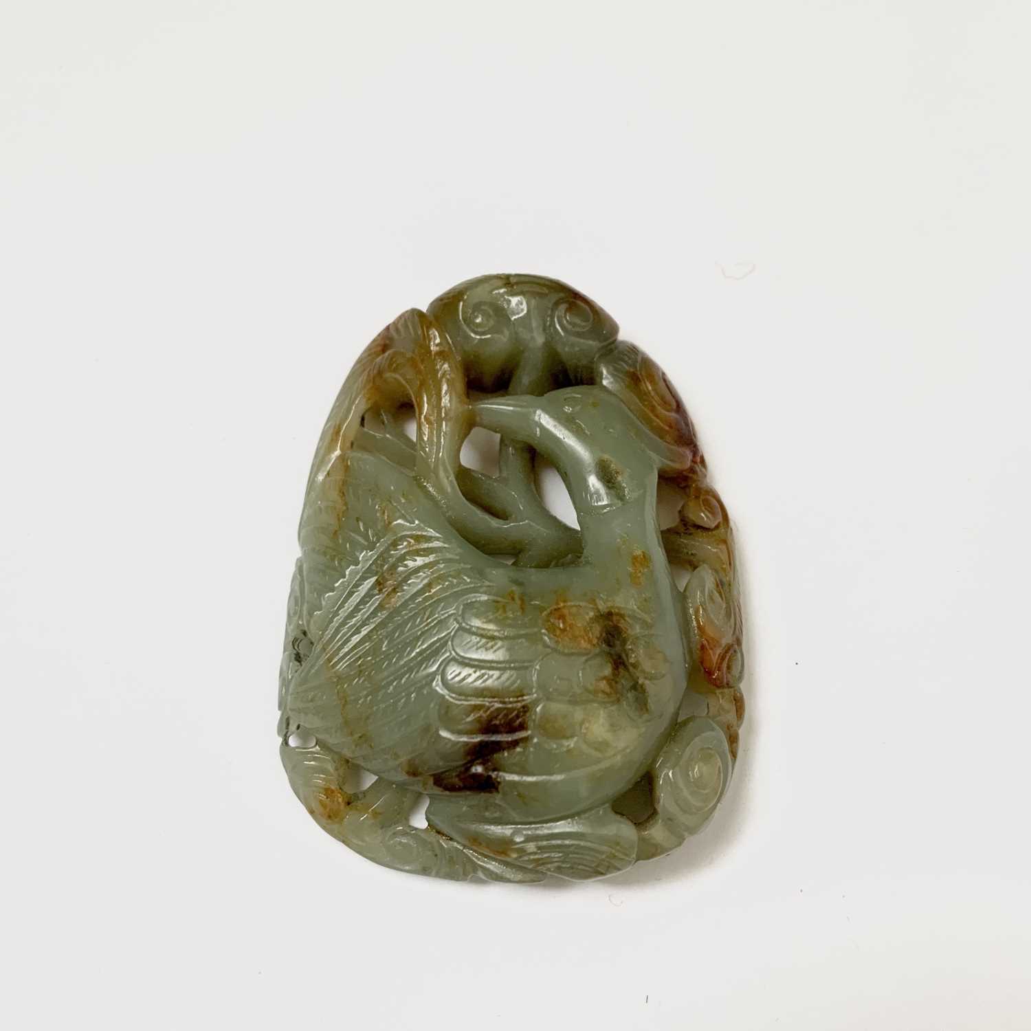 A Chinese carved & reticulated celadon jade ornament, depicting a bird & lingzhi, with russet - Image 12 of 14