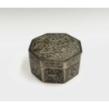 A Chinese silver octagonal box, with foliate decoration and character mark to base, height 3.5cm,