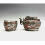 A Chinese Yixing pottery teapot and sugar bowl, early 20th century, with applied pewter mounts and