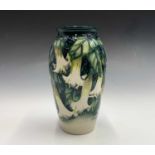 A Moorcroft 'Angels Trumpets' pattern vase, designed by Anji Davenport, having tube lined floral